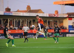 Dan Potts gets in the air to control the ball