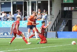 Cameron McGeehan nips in between defenders to give the Town a 2-0 lead