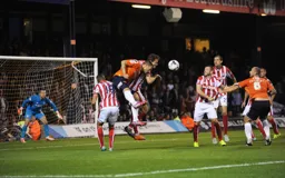 Luke Wilkinson and Scott Cuthbert attack the Stoke goal