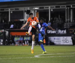 Jonathan Smith looks to play the ball into the penalty area