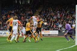 Luke Wilkinson heads in Town`s second goal