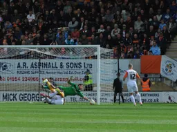 Mark Tyler gets down low save one handed