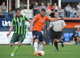 Josh McQuoid holds of Dannie Bulman