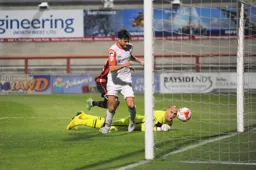 Jonathan Smith walks the ball into the net for Town`s third goal