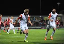 Cameron McGeehan celebrates his goal with Josh McQuoid