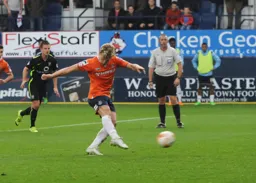 MAIN PAGE Cameron McGeehan levels the scores from the penalty spot