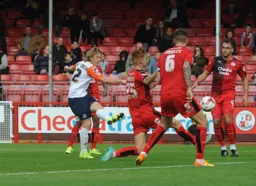 Craig Mackail-Smith takes a shot at goal watched by future Hatter Sonny Bradley