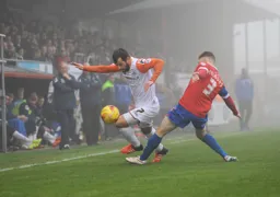 Alex Lawless goes wide to get past Jack Connors