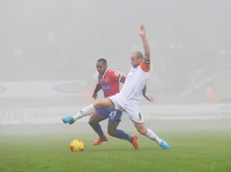 Scott Cuthbert at full stretch to win the ball