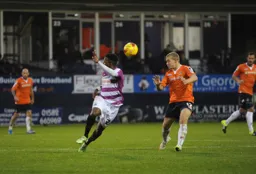 Scott Griffiths heads the ball forward