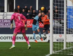 Scott Cuthbert goes up for a header with Jason McCarthy in close attendance