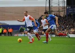 Jake Howells is closed down by Gareth Evans