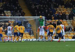 Elliot Justham gets above Scott Cuthbert to safely catch the ball