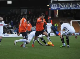 Alex Lawless weaves his way through the Notts County defence