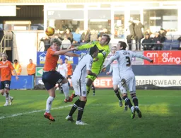 Cameron McGeehan gives Roy Carroll an uncomfortable moment
