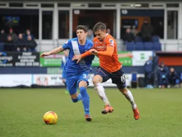 Olly Lee tussles for the with future Hatter Jake Gray