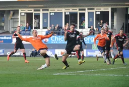 Paul Benson`s attempt at goal is blocked by Sonny Bradley
