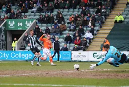 Luke McCormick gets down to save this attempt at goal from Jack Marriott