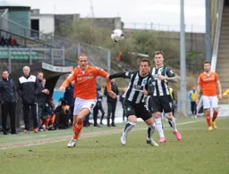 Paul Benson goes out wide in pursuit of the ball