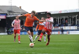 Cameron McGeehan forces his way past Bradley Pritchard