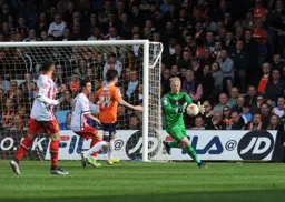 Jonathan Mitchell safely gathers the ball