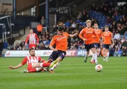 A sliding tackle dispossess Jonathan Smith