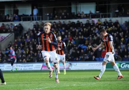 Joe Pigott is off to celebrate scoring his second goal