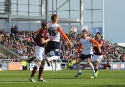Joe Pigott holds the ball up with Cameron McGeehan in support