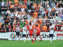 Elliot Justham shows a safe pair of hands in front of the travelling faithful