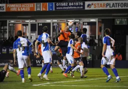 Scott Cuthbert rises highest to send a header goalwards