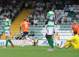 Paul Benson turns away after scoring Town`s second goal. Danny Green looks happy about it