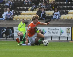 Cameron McGeehan goes to ground and gets a boot to the chest for his troubles