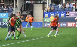 Jack Marriott gets in front of two defenders to score his and Town`s first goal