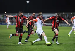 Paddy McCourt finds himself surrounded by three defenders