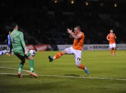 Jack Marriott moves in menacingly on Stuart Nelson