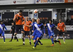 Jack Marriott sends a header towards goal