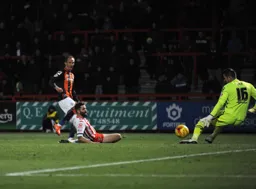 Paul Benson`s shot is blocked by Chris Day