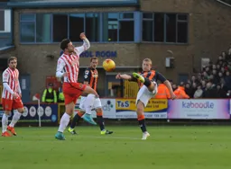 Scott Griffiths volleys the ball clear