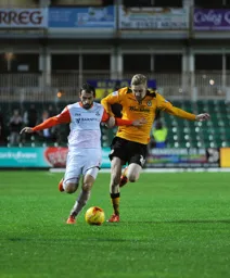 Alex Lawless in a race for the ball