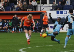 Cameron McGeehan tries a shot from twenty five yards out