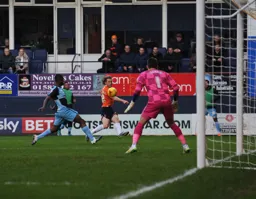 Craig Mackail-Smith shoots from the left hand side