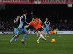 Sean Long plays a side foot pass