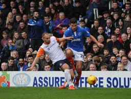 Jake Howells plays the ball away from Gareth Evans