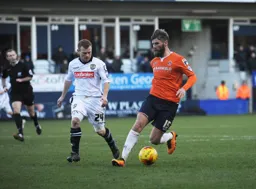 Paddy McCourt dribbles the ball past Adam Campbell
