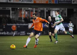 Alex Lawless looks to play the ball forward