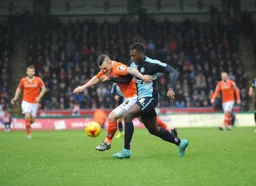 Jack Marriott wrestles for the ball with Aaron Pierre
