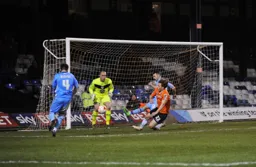 Former Hatter Alan Goodall moves in to block Craig Mackail-Smith