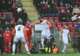 Paddy McCourt heads the ball forward
