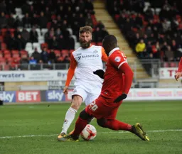 Paddy McCourt is tackled by Jerome Williams
