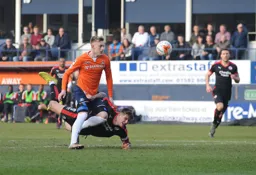 Joe Pigott bursts through leaving future Hatter Sonny Bradley sprawling